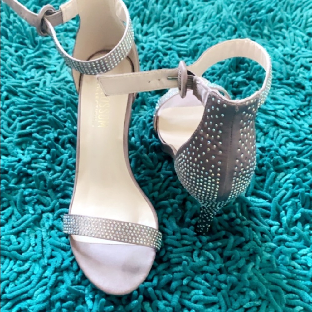 Ankle-strap heals with iridescent gems.